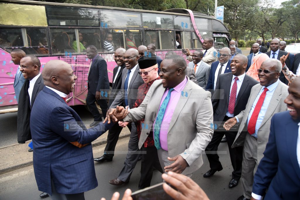 Gideon Moi shaking hands with Cleophas Malala as they marched to Milimani Law Courts