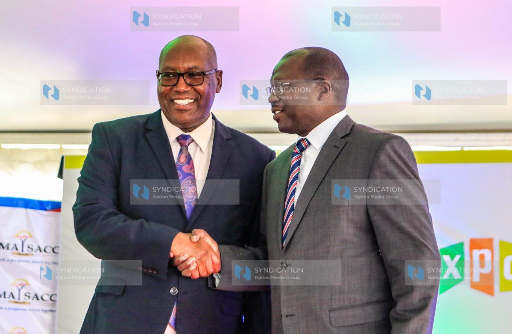 Nation Media Group’s CEO Stephen Gitagama and CS for Co-operatives and Micro Small and Medium Enterprise Simon Chelugui