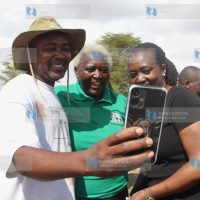 Environment Cabinet Secretary Soipan Tuya takes a selfie with environmentalists