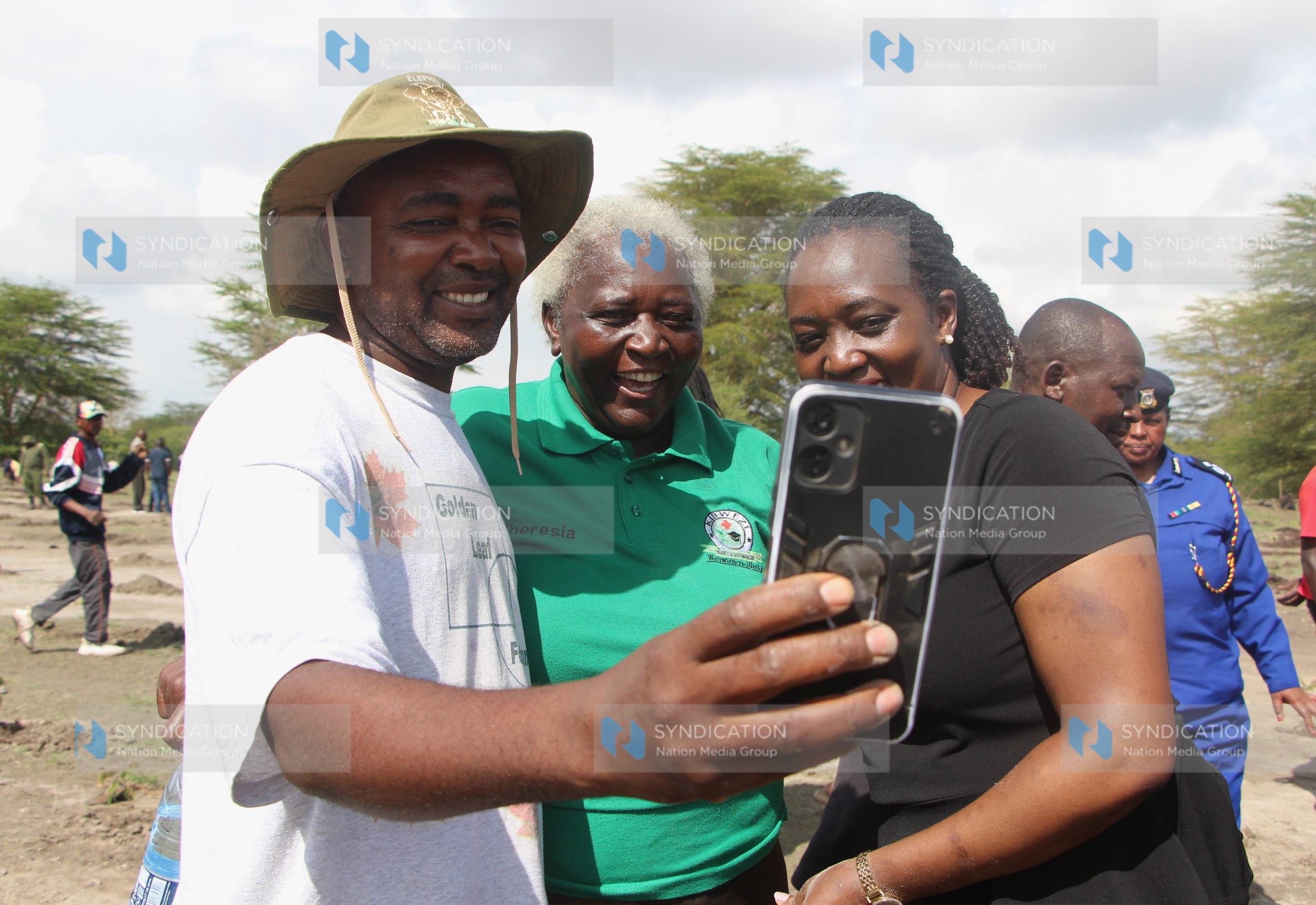 Environment Cabinet Secretary Soipan Tuya takes a selfie with environmentalists