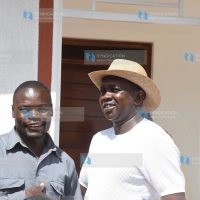 Kapseret MP Oscar Sudi (right) hands over a three-bedroom house to his employee