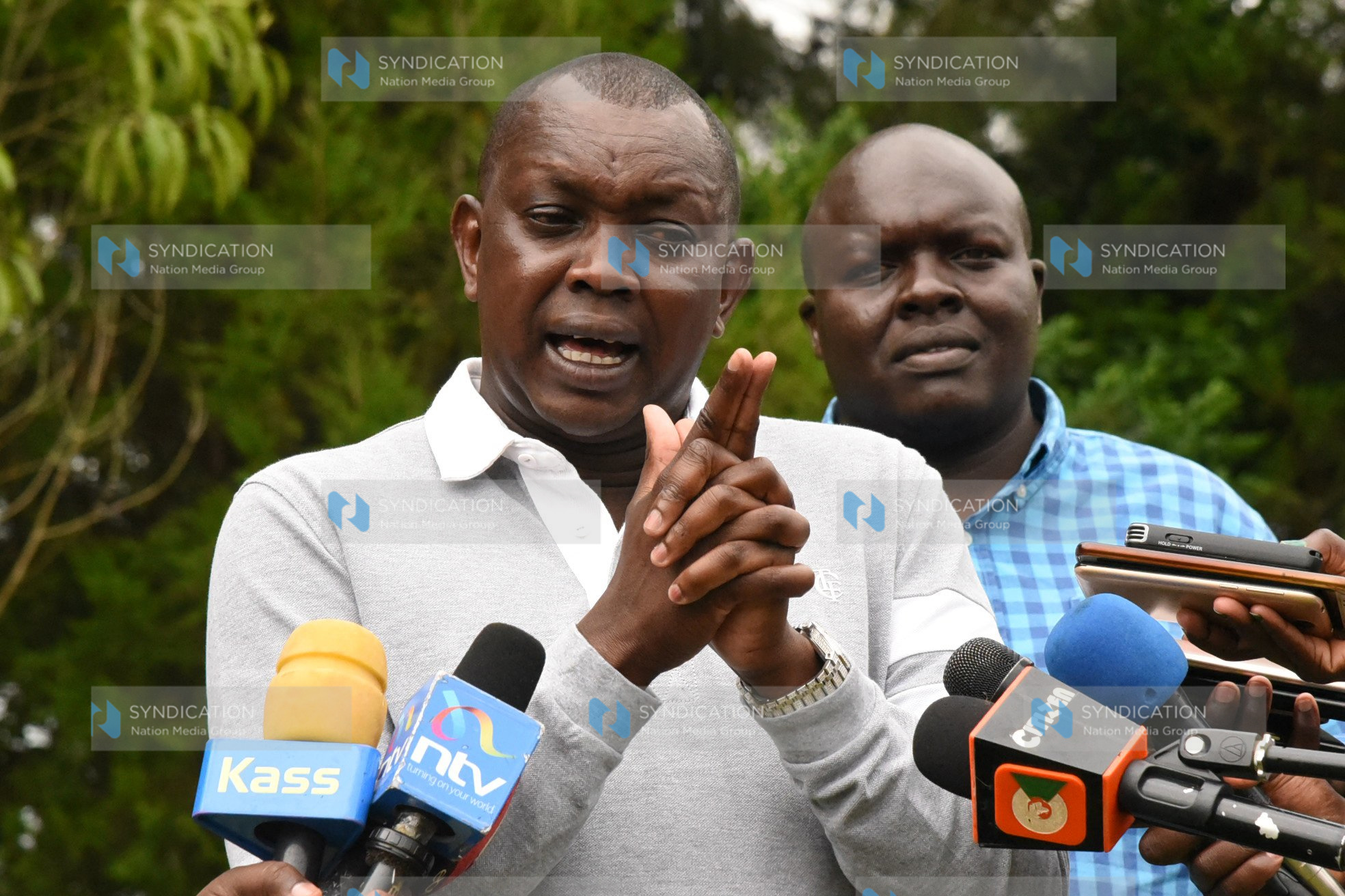 Kapseret MP Oscar Sudi, accompanied by former Wareng County Council Chairman Paul Kiprop, addresses the press