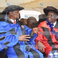 Kapseret MP Oscar Sudi (right) and Sirisia MP John Waluke after receiving honorary degrees