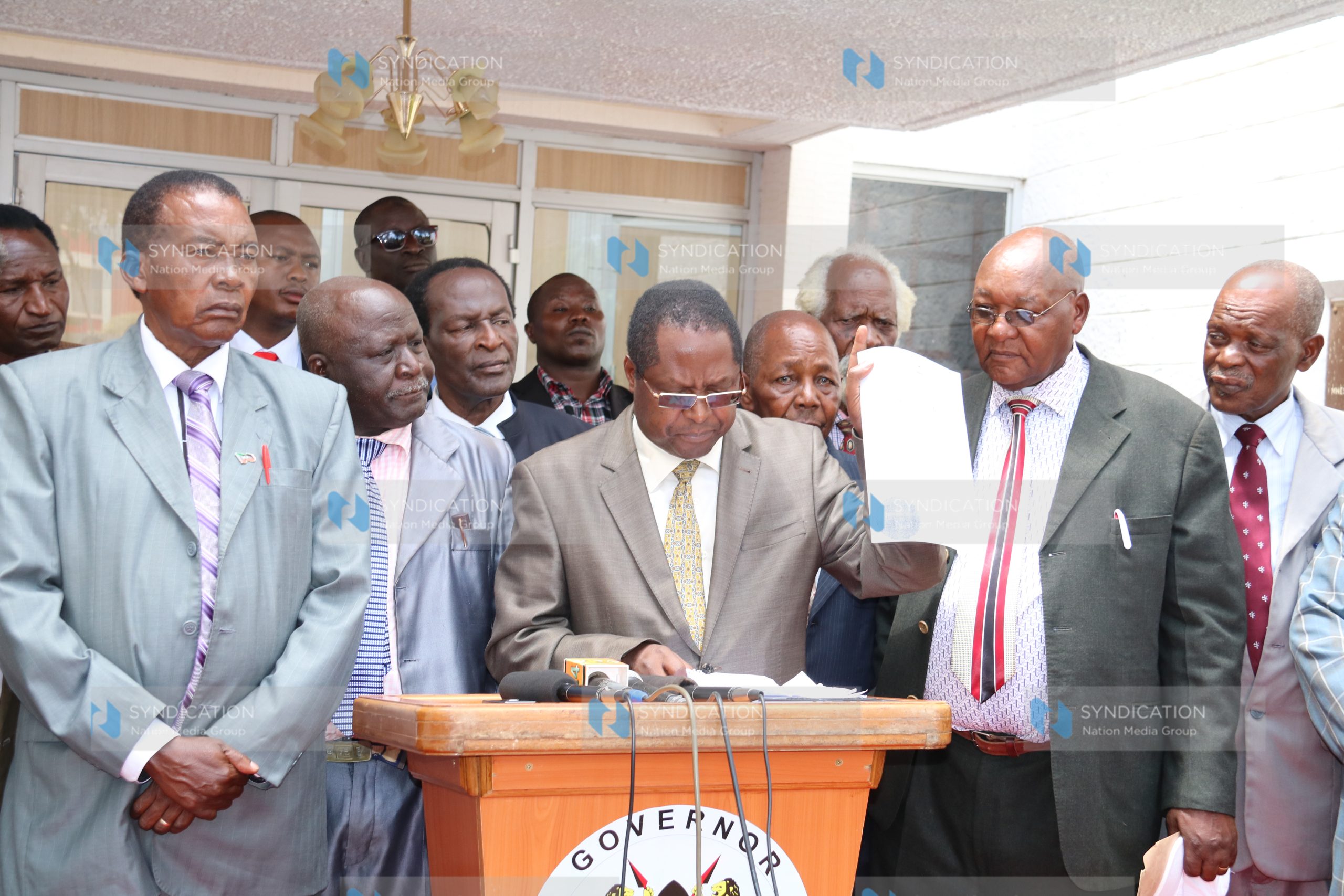 Governor Martin Wambora addresses the press outside his office