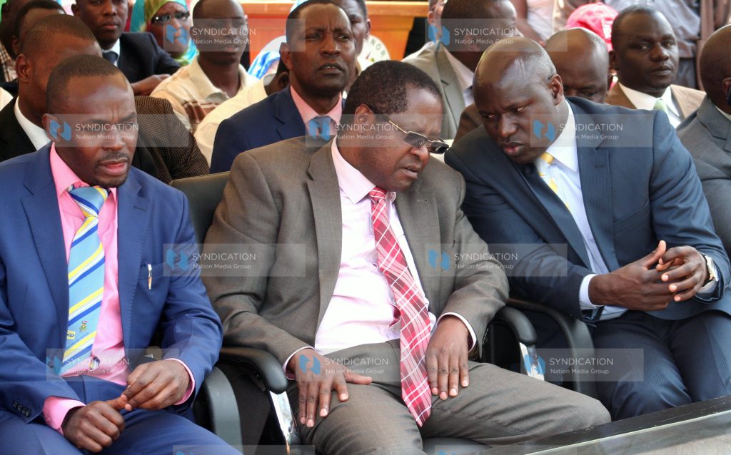 Embu Governor Martin Wambora (centre) chats with Embu County Assembly Speaker Kariuki Mate