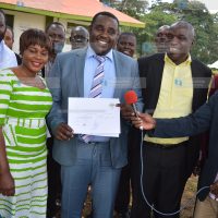ANC senate aspirant of Kakamega Cleophas Malala displaying an IEBC certificate