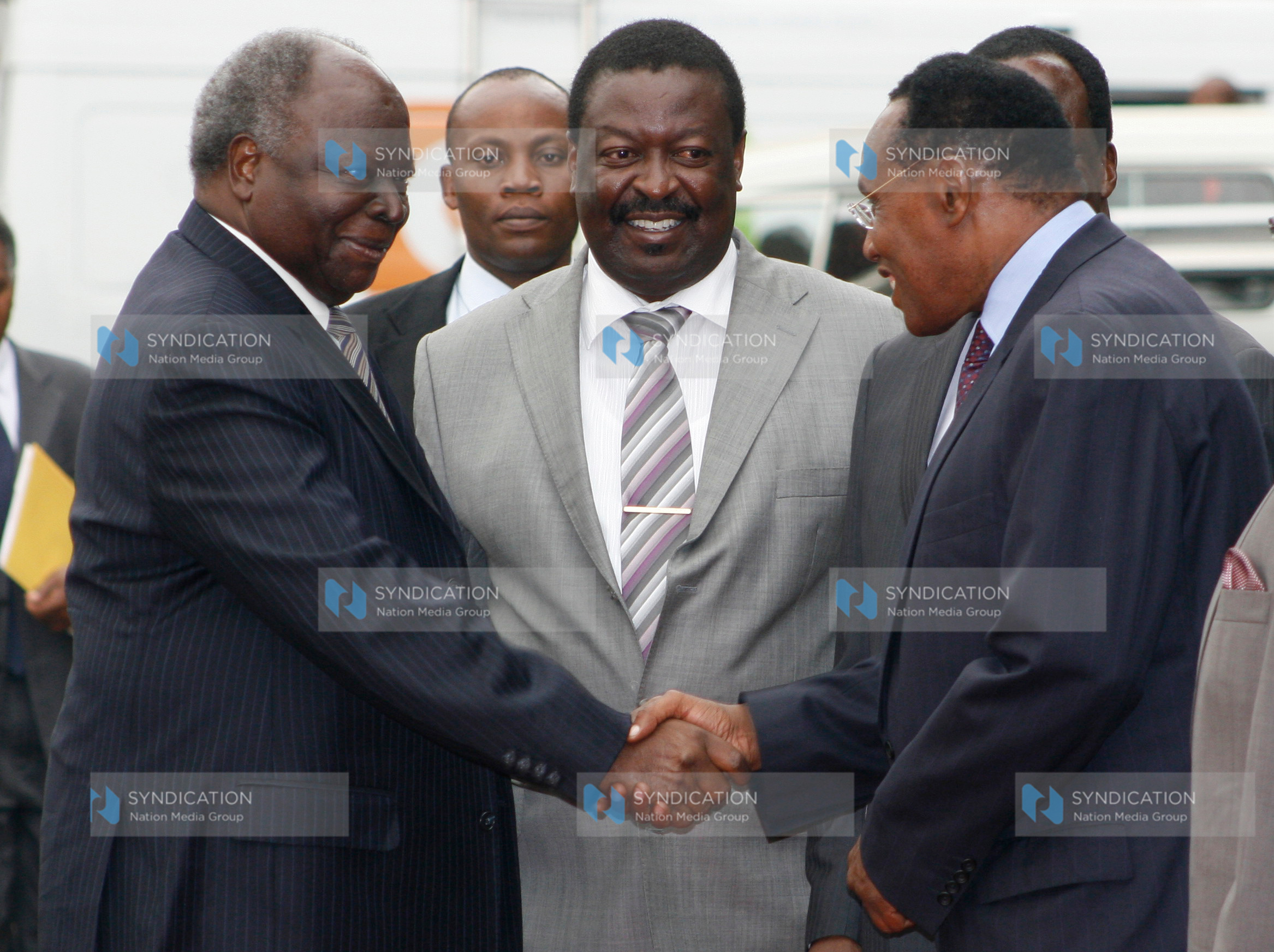 President Mwai Kibaki is received by Deputy Prime Minister and Minister for Local Government Musalia Mudavadi and Internal Security Minister George Saitoti