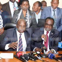 UASU Secretary General Dr. Constantine Wasonga and Education Cabinet Secretary Julius Migos Ogamba