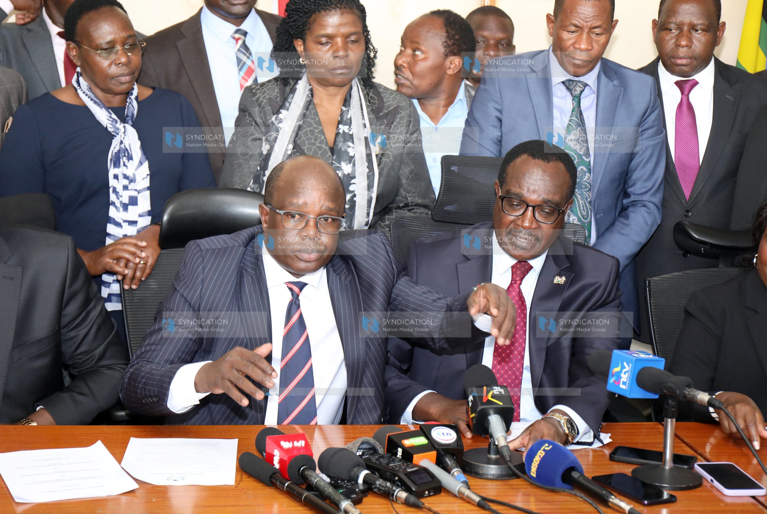 UASU Secretary General Dr. Constantine Wasonga and Education Cabinet Secretary Julius Migos Ogamba