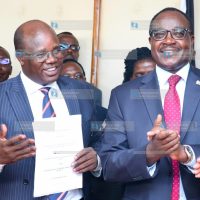 UASU Secretary General Dr. Constantine Wasonga and Education Cabinet Secretary Julius Migos Ogamba