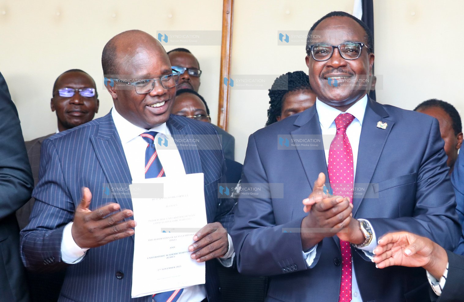 UASU Secretary General Dr. Constantine Wasonga and Education Cabinet Secretary Julius Migos Ogamba