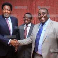 Newly elected senate deputy minority leader Kakamega Senator Cleophas Malala, shake hands with Narok senator Ledama ole Kina