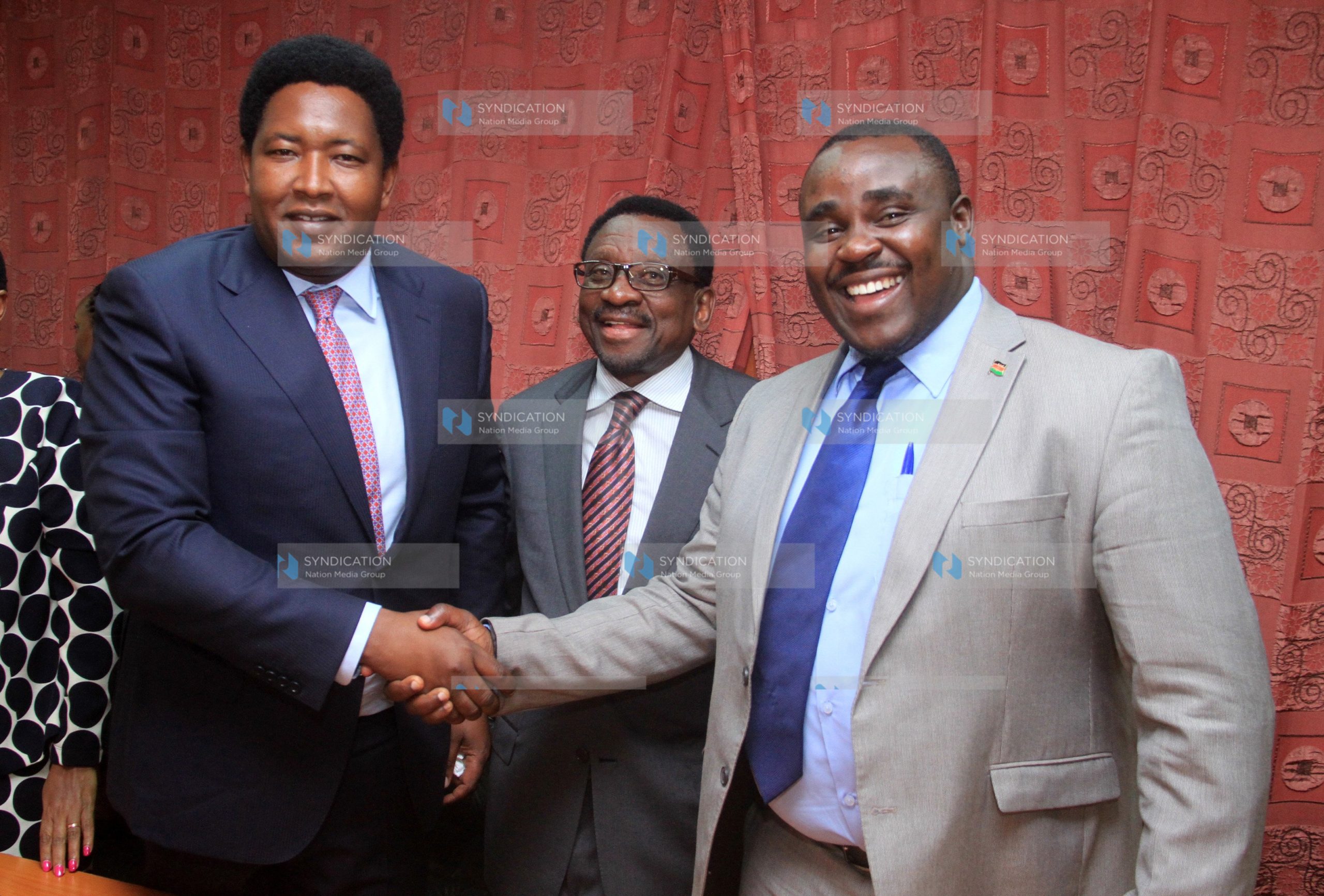 Newly elected senate deputy minority leader Kakamega Senator Cleophas Malala, shake hands with Narok senator Ledama ole Kina