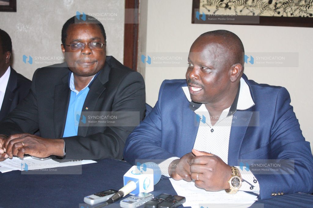 Council of Governors Chair Isaac Ruto (right) confers with Bungoma Governor Kenneth Lusaka during a press conference