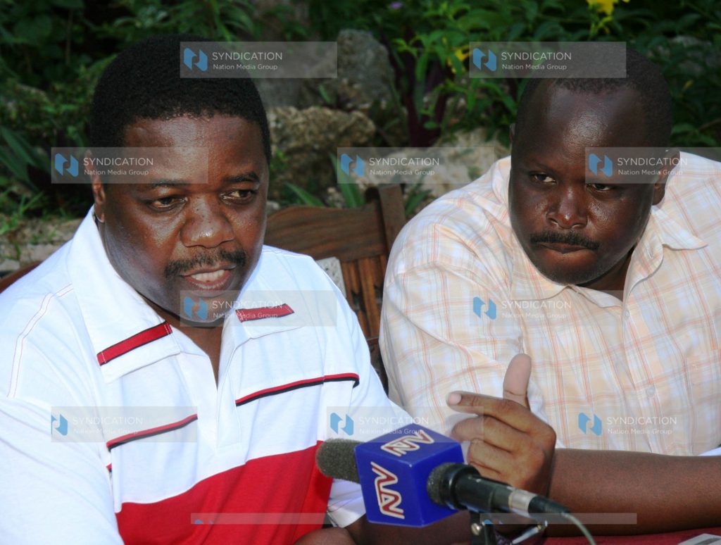 Chairman of the Parliamentary Committee on Education David Koech listens to his Chepalungu counterpart Isaac Ruto