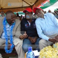 Kapseret MP Oscar Sudi (right) shares a light moment with Bomet Governor Isaac Ruto (left) during a fundraiser