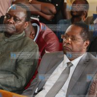 Embu Governor Martin Wambora (right), together with former Embu Senator Lenny Kivuti (left), follows the proceedings of an election petition