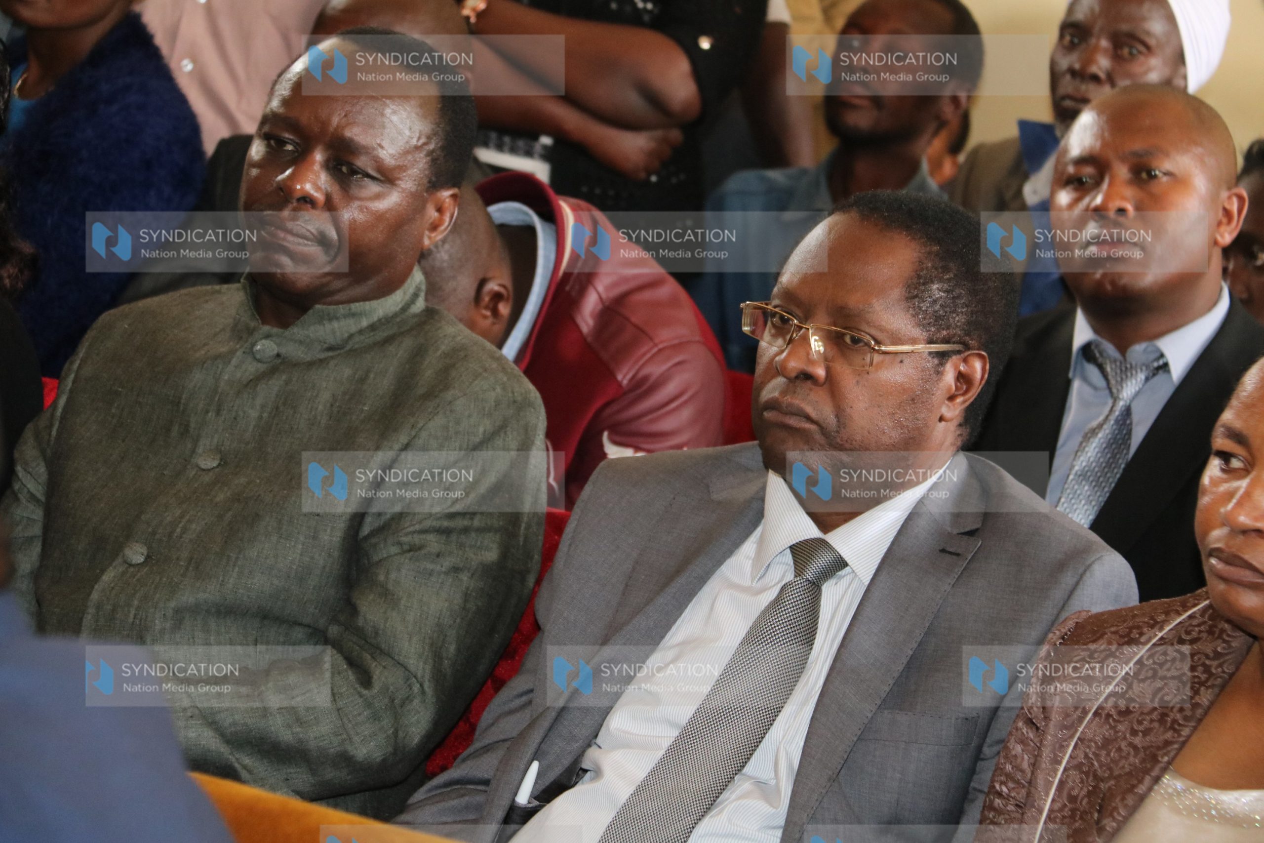 Embu Governor Martin Wambora (right), together with former Embu Senator Lenny Kivuti (left), follows the proceedings of an election petition