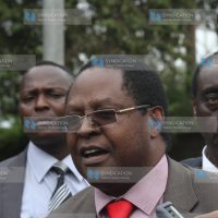 Embu Governor Martin Wambora, flanked by his lawyer Paul Muite (right), addresses the media