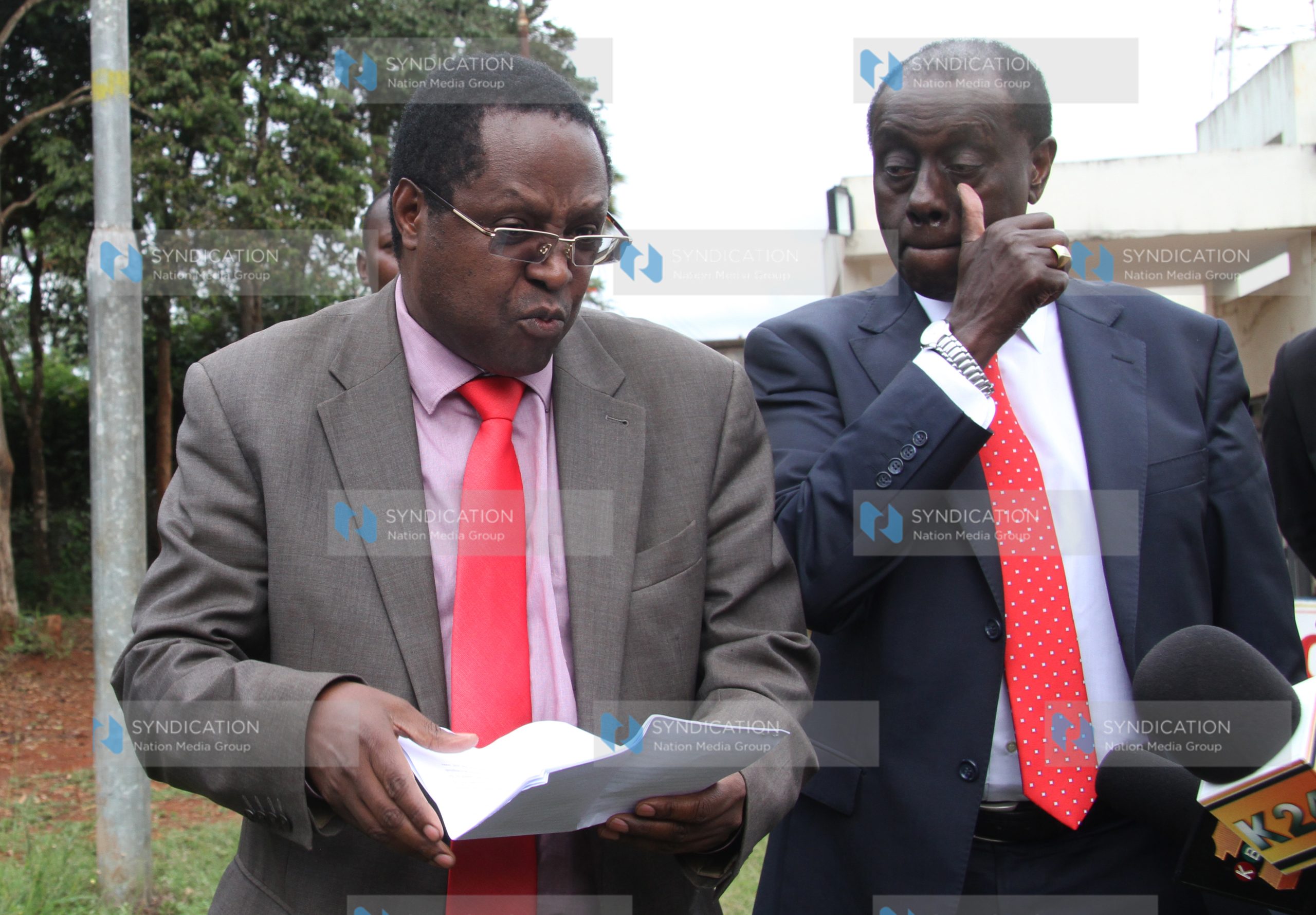 Embu Governor Martin Wambora (left), flanked by his lawyer Paul Muite, addresses the media