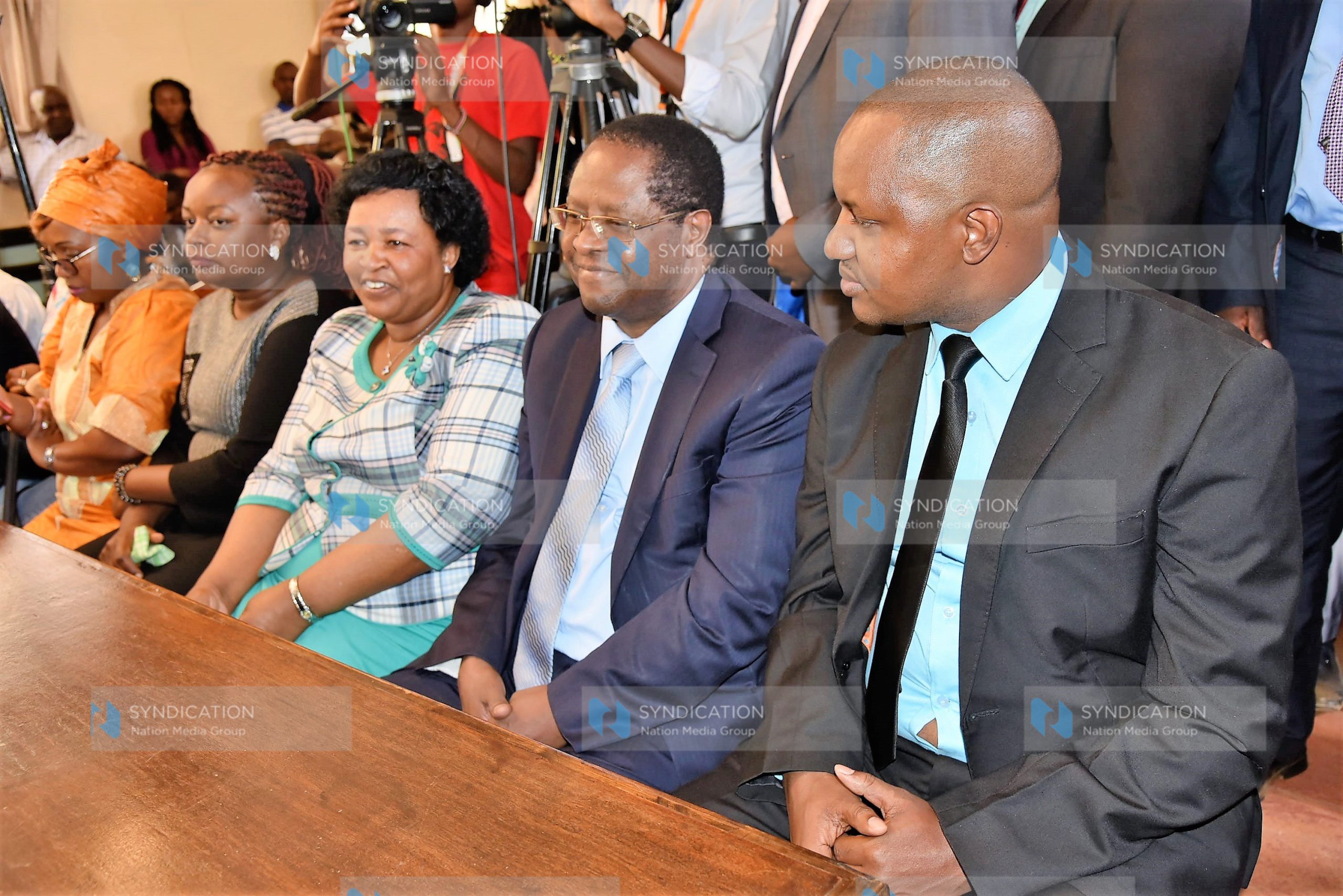 Embu Governor Martin Wambora (second right), his deputy David Kariuki (right), and Wambora’s wife Teresa appear in court