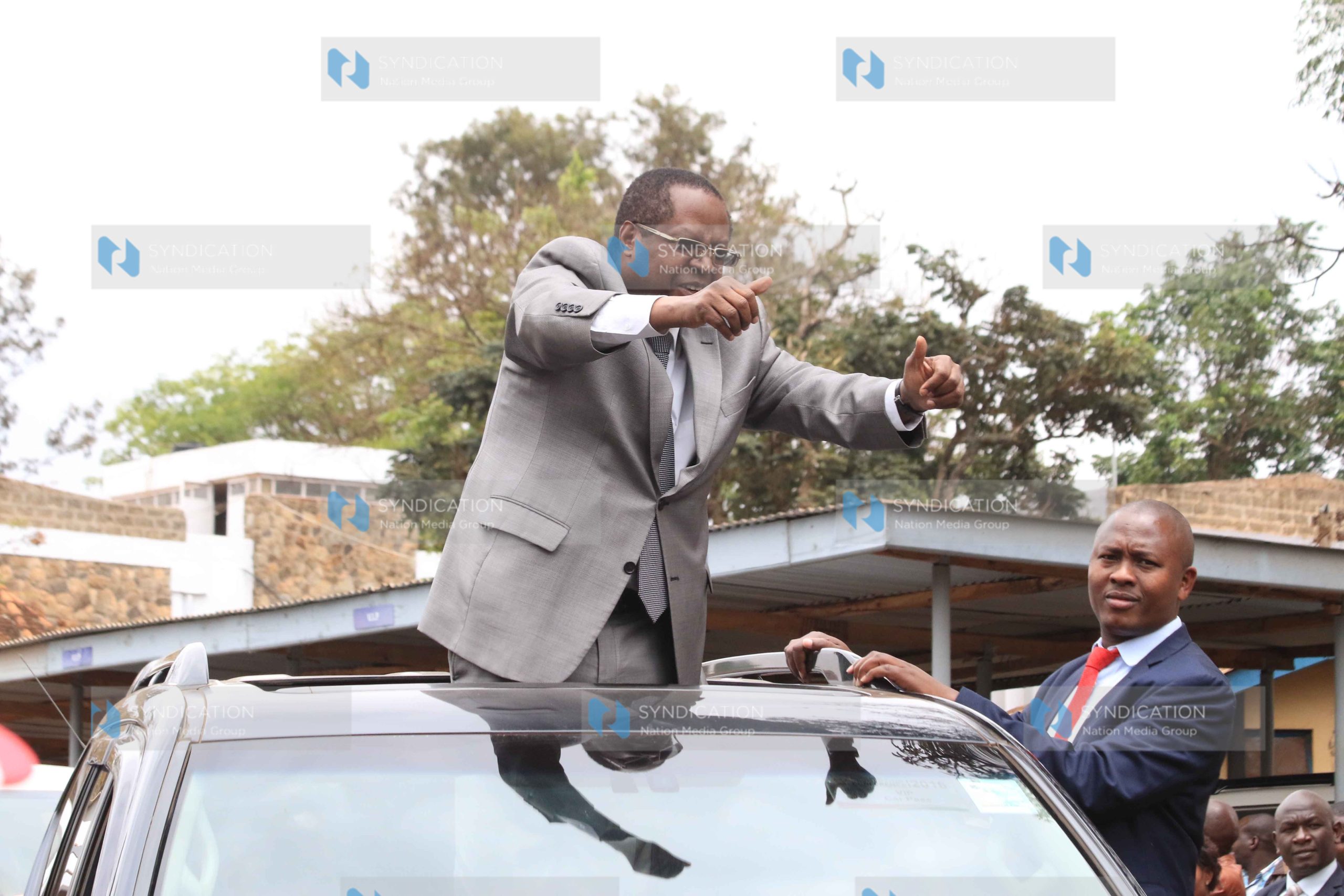 Embu Governor Martin Wambora acknowledges greetings from wananchi