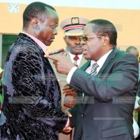 Embu Governor Martin Wambora chats with Embu Senator Lenny Kivuti