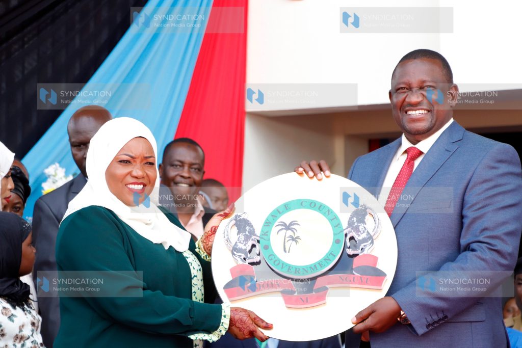 Kwale Governor Fatuma Achani receives instruments of power from her predecessor Salim Mvurya