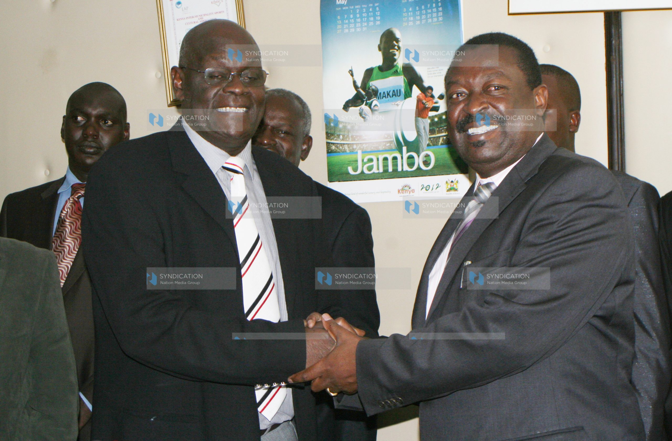 The Deputy Prime Minister and Minister for Local Government Musalia Mudavadi hands over his ministry to the Minister for Regional Development Fred Gumo