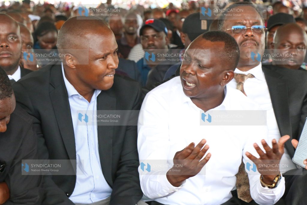 Former Nandi Hills MP Alfred Keter converses with Kapseret MP Oscar Sudi