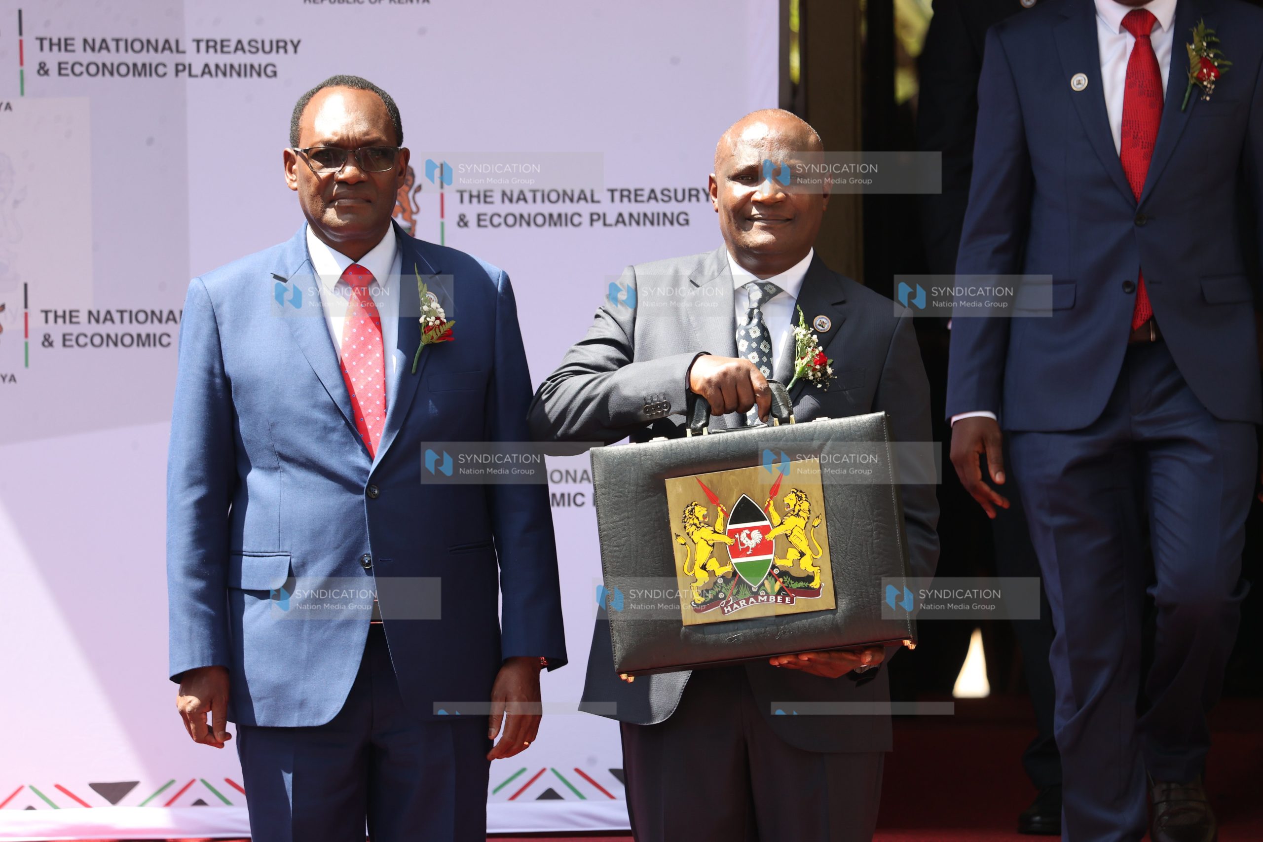 John Mbadi together with PS Chris Kiptoo displays the Budget briefcase
