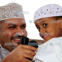 Said Swaleh (right), from Madrassatul Khushui in Mkomani, Kisauni District, is congratulated after emerging as the top pupil