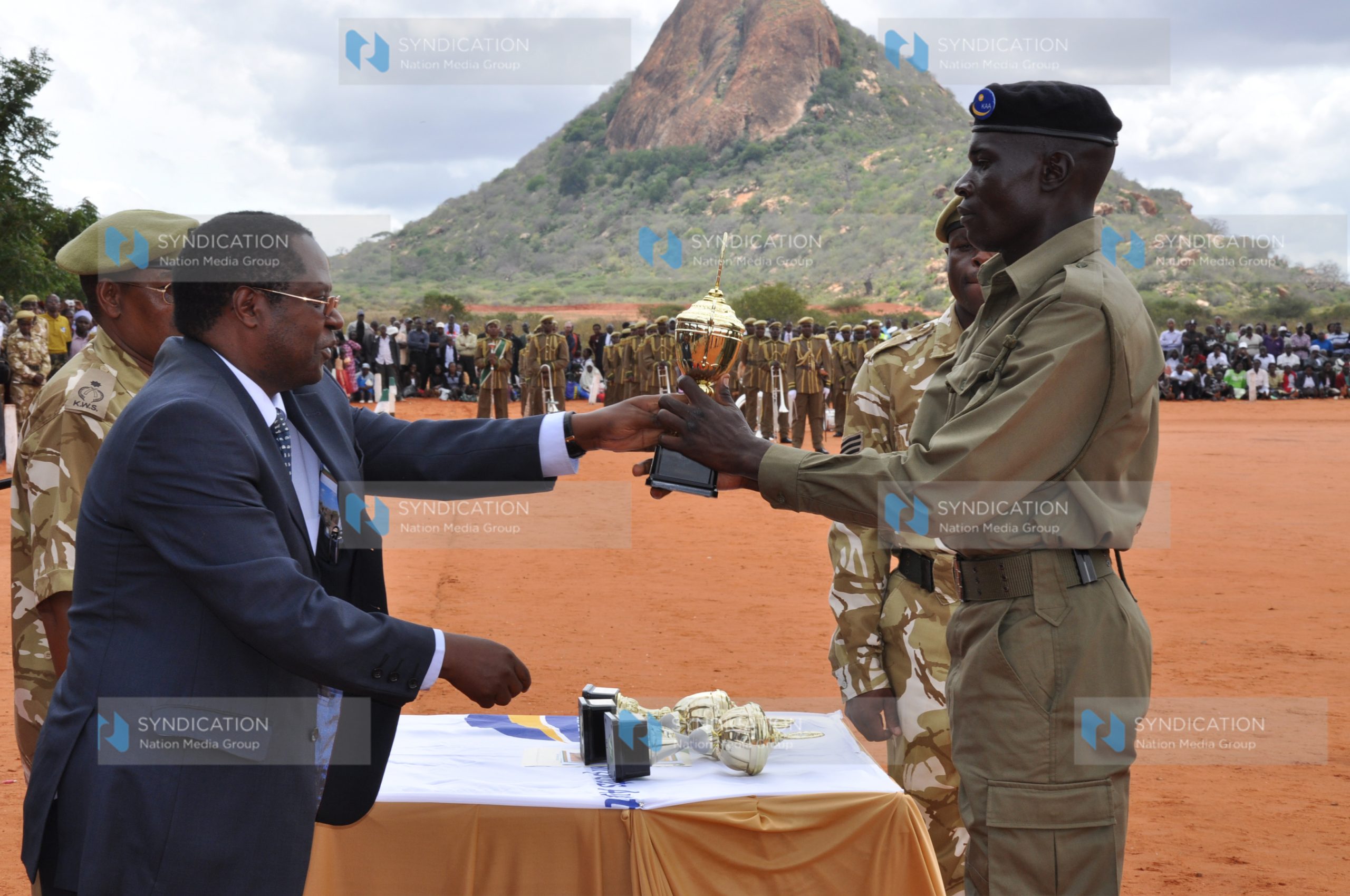 The best recruit in drill and turnout receives an award from KAA chairman Martin Wambora