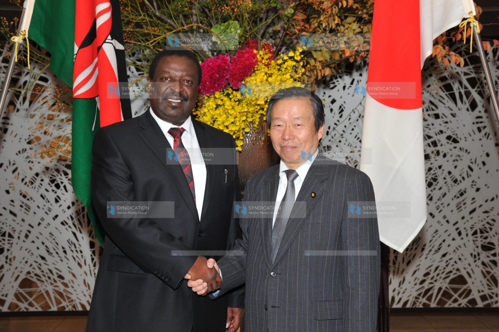 Deputy Prime Minister Musalia Mudavadi shakes hands with the Deputy Foreign Minister of Japan