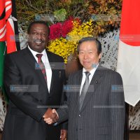 Deputy Prime Minister Musalia Mudavadi shakes hands with the Deputy Foreign Minister of Japan