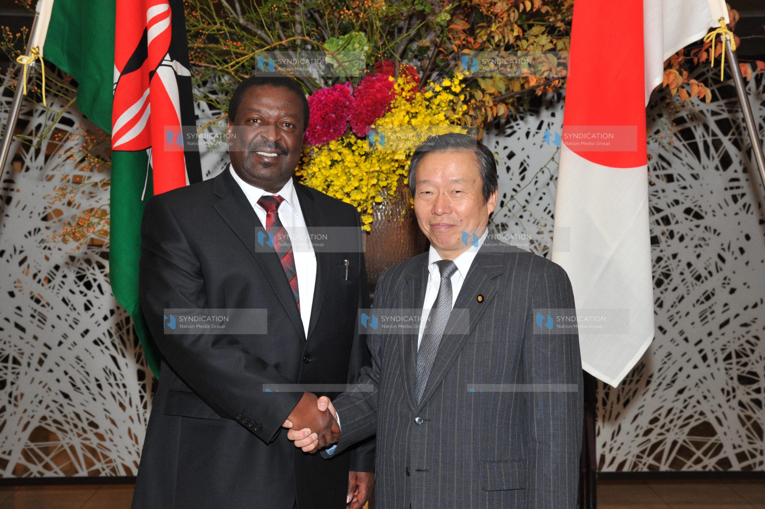 Deputy Prime Minister Musalia Mudavadi shakes hands with the Deputy Foreign Minister of Japan