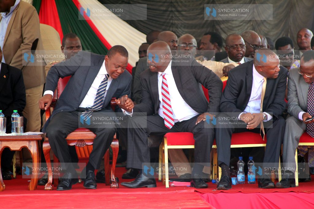 Governor Isaac Ruto converses with President Uhuru Kenyatta