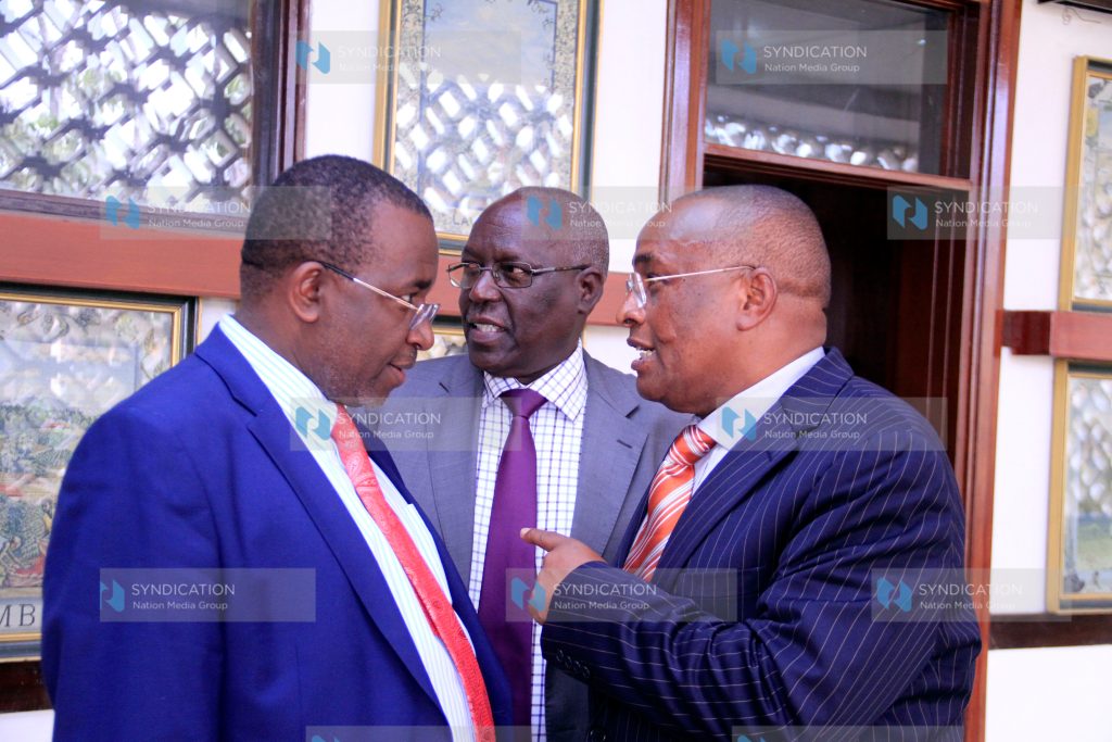 NSSF Board of Trustees member Erastus Mwongera (centre).