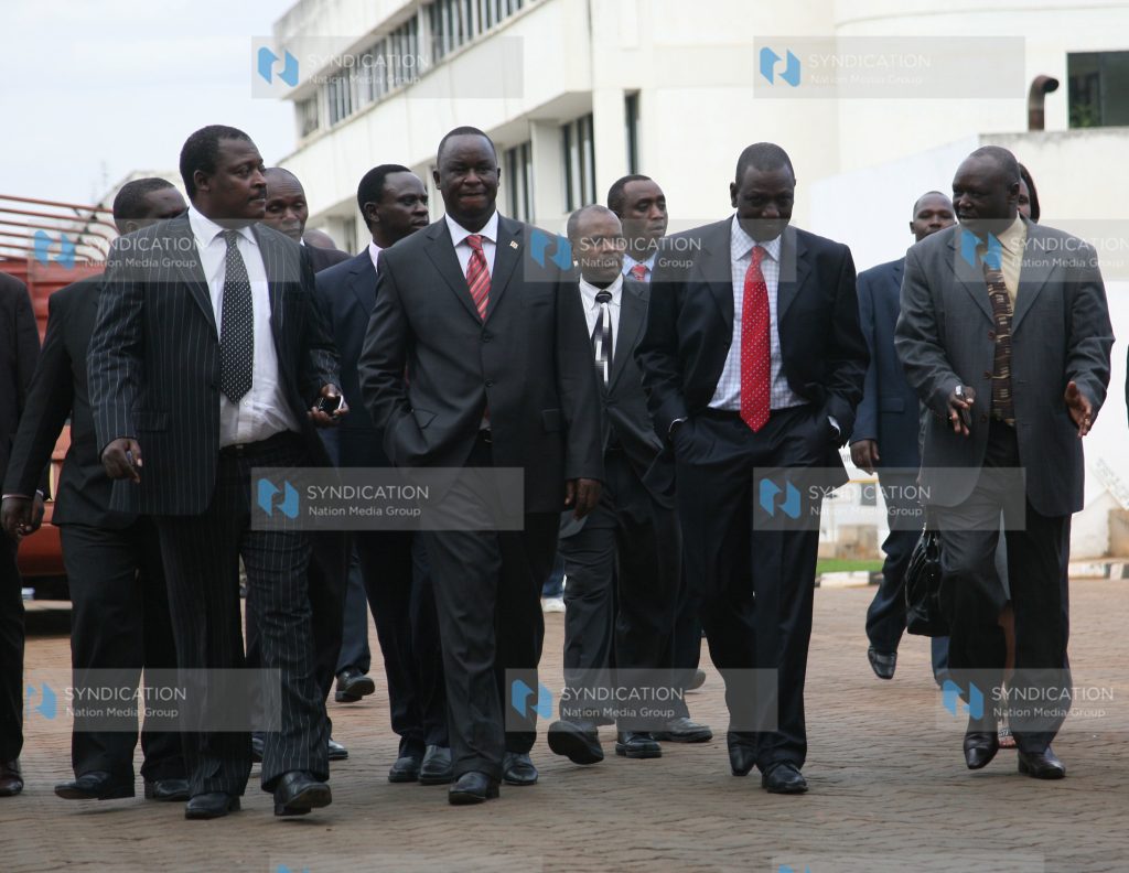 Cyrus Jirongo, Kiema Kilonzo, and Luka Kigen walk out of the CID headquarters
