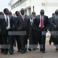 Cyrus Jirongo, Kiema Kilonzo, and Luka Kigen walk out of the CID headquarters