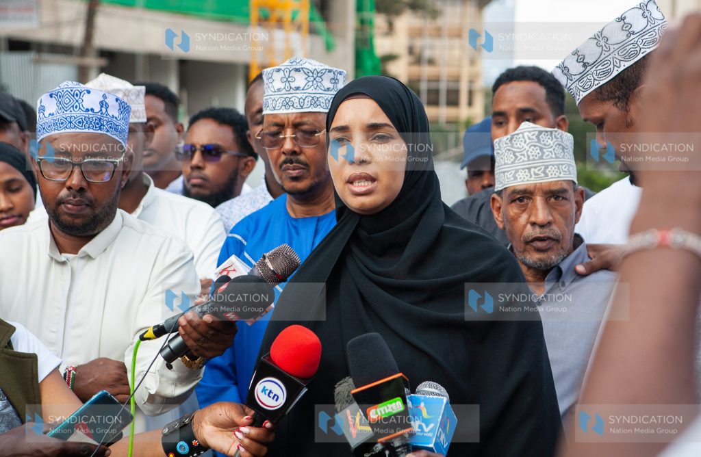 Wajir woman representative Fatuma Jehow flanked by a section of residents from Northeastern region address journalists