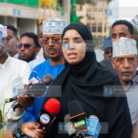 Wajir woman representative Fatuma Jehow flanked by a section of residents from Northeastern region address journalists