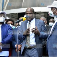 (IEBC) Chairman Wafula Chebukati (center) makes his remarks