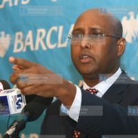 Adan Mohamed announcing bank's financial performance for 2011