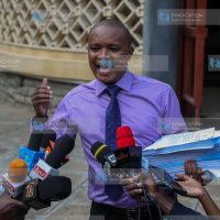 Kuria Kimani addresses the media at Parliament Buildings
