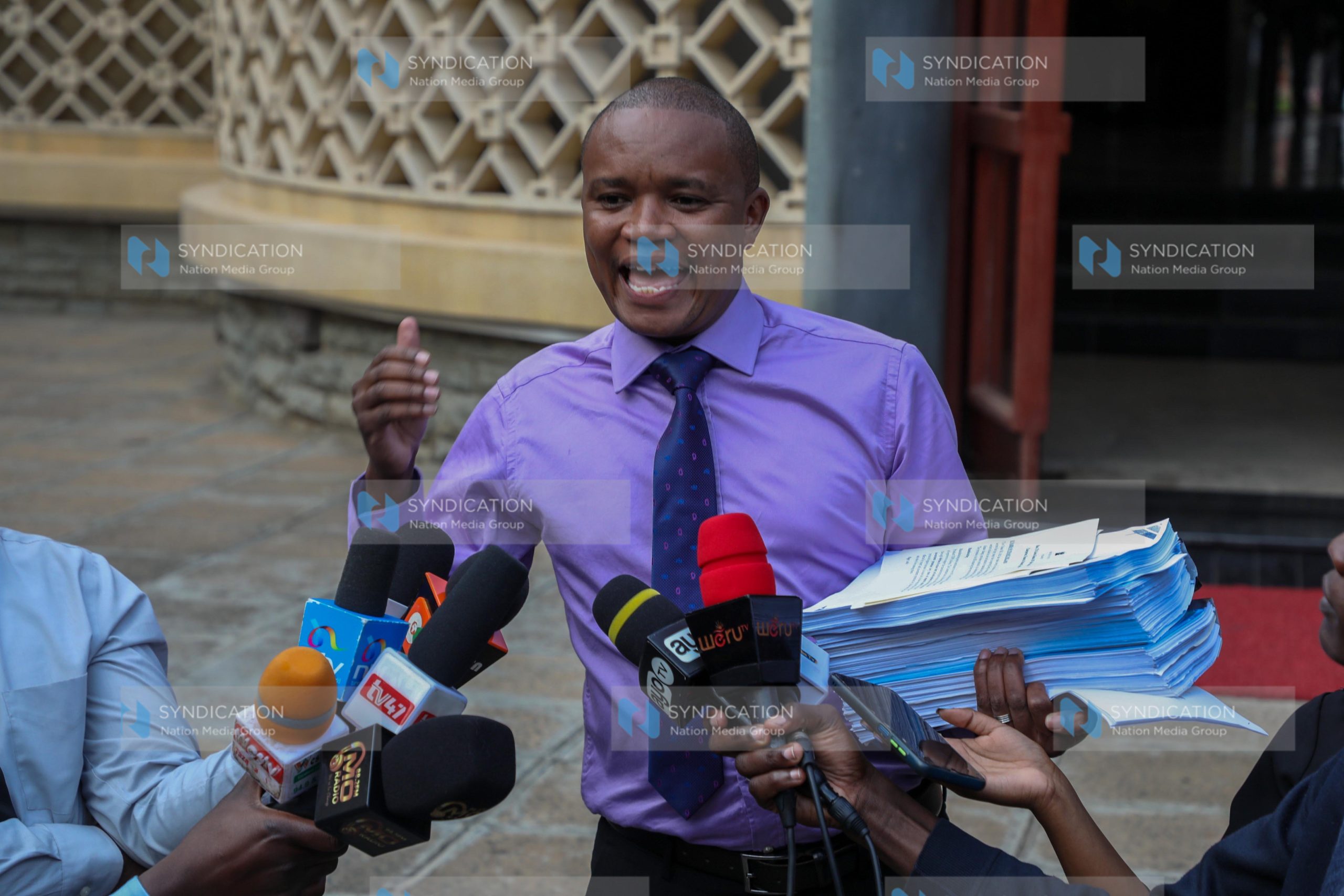 Kuria Kimani addresses the media at Parliament Buildings