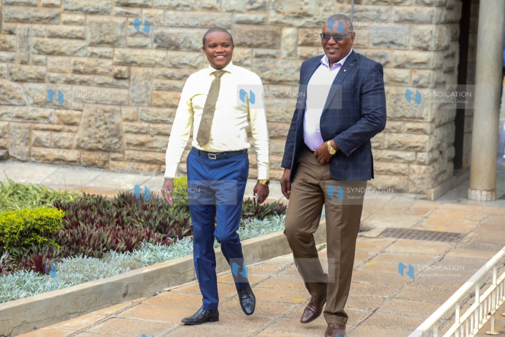 Kimani Kuria (Left) and Kitui Rural Mboni David Mwalika at Parliament buildings