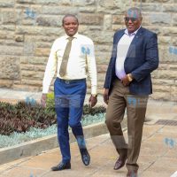 Kimani Kuria (Left) and Kitui Rural Mboni David Mwalika at Parliament buildings