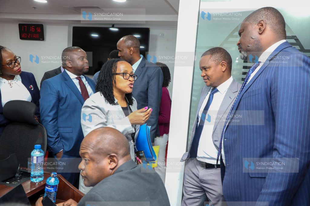 Finance and National Planning, Kuria Kimani (centre)