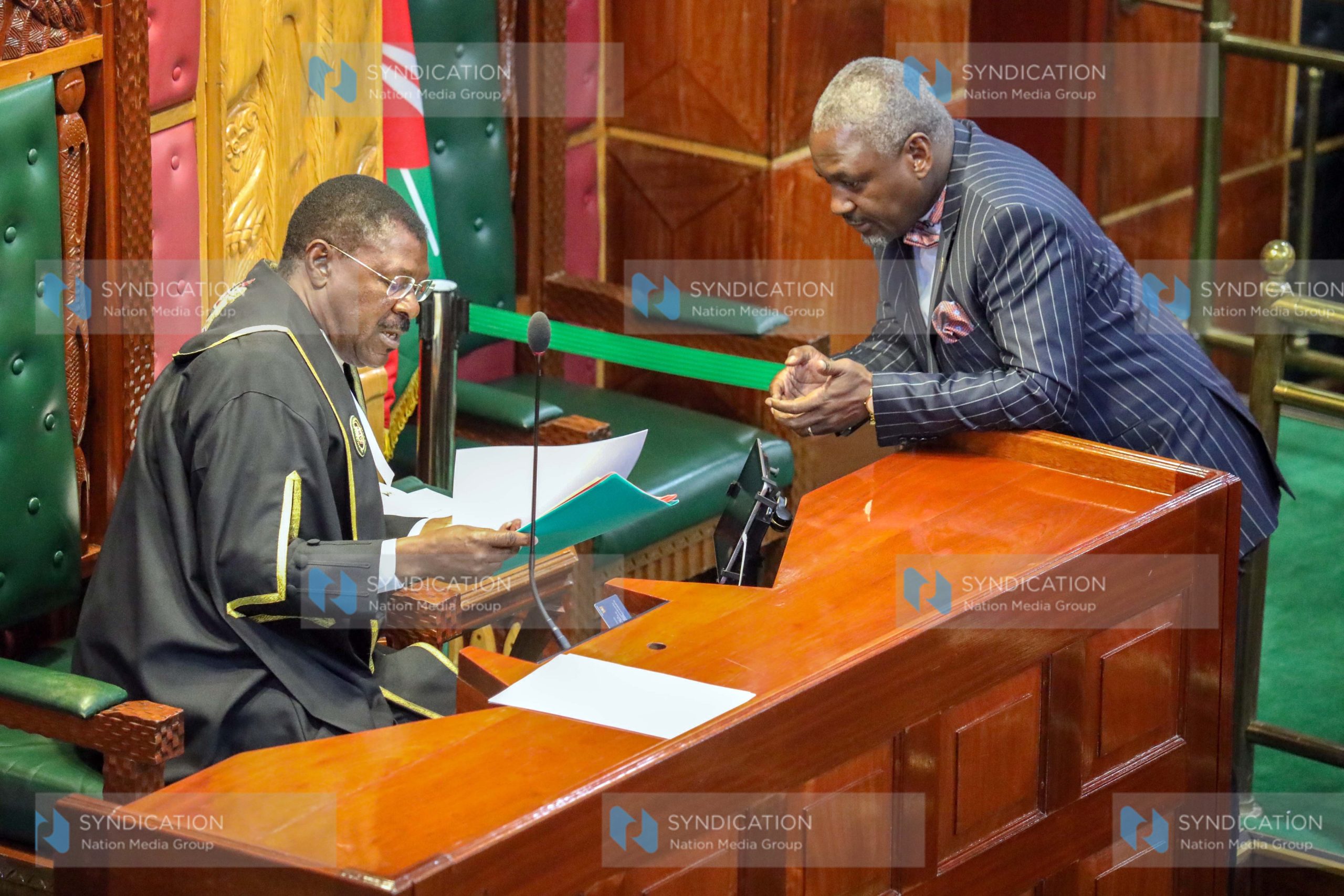 Speaker of the National Assembly Moses Wetang’ula shares a word with Rarieda MP Amollo Paul Otiende in the chambers